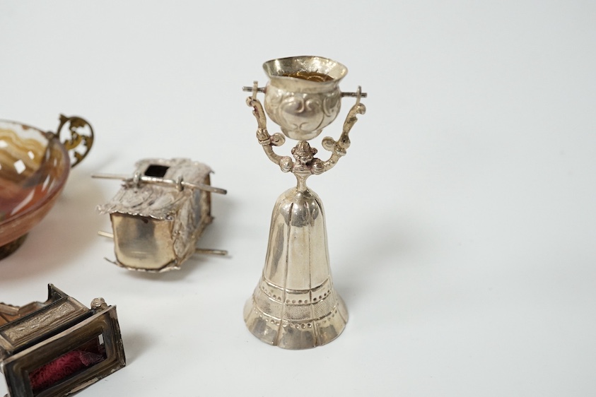 An Edwardian miniature silver wager cup, by Levi & Salaman, 70mm, a miniature white metal Sedan chair, an Edwardian miniature silver mounted pin cushion modelled as a throne, Gourdel Vales & Co, Birmingham, 1901 an a 19t